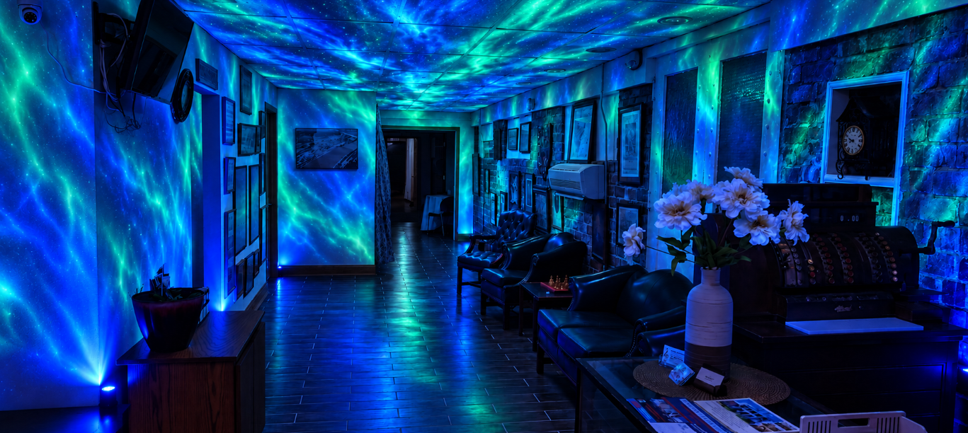 The Tunnel with seating beneath blue and green aurora lighting